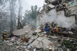 Rescuers work in a destroyed apartment building after a Russian missile attack in Kyiv, Ukraine, on July 31, 2025.